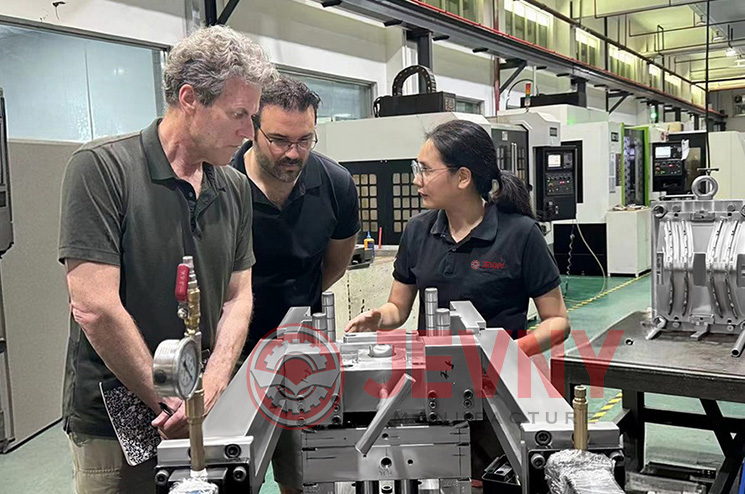 Jevny team discussing product details with a client in our workshop